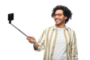 happy-young-man-taking-selfie-with-smartphone_380164-293404